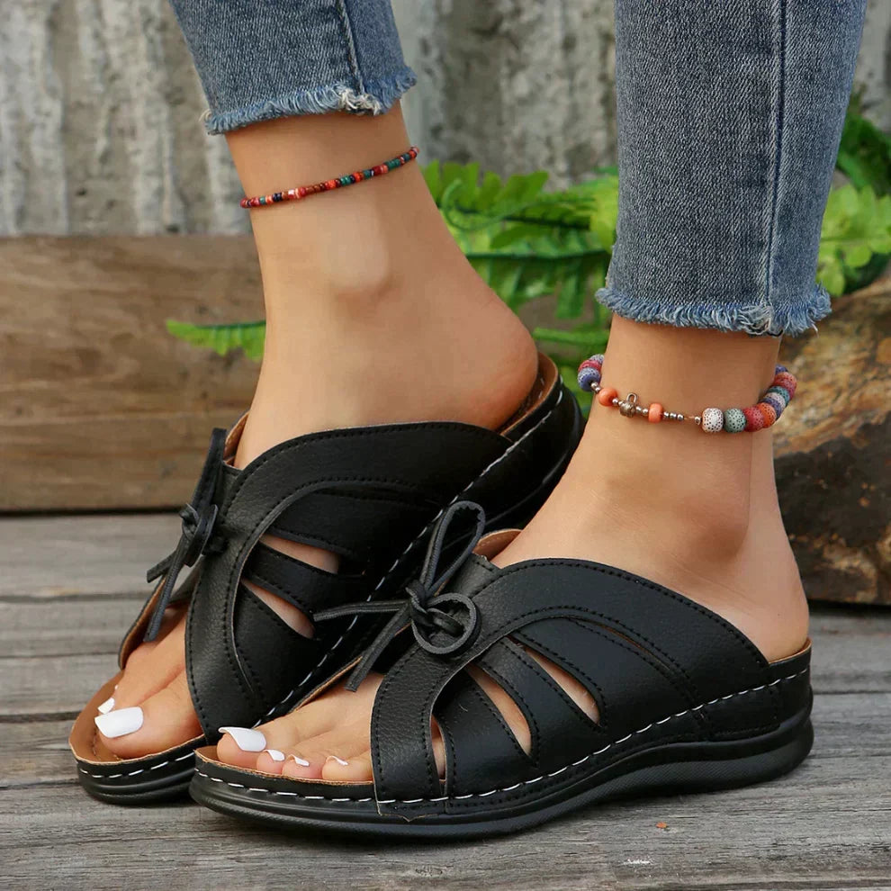 Fashionable women's wedge shoes, open toe with elegant knot detail. Ideal casual summer sandals.