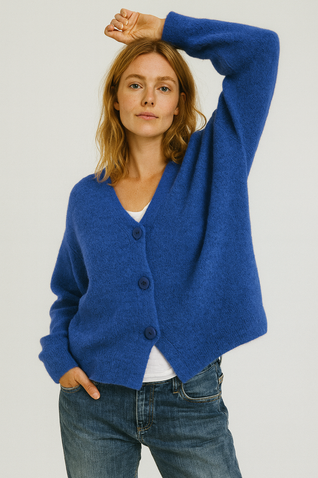 Dark green long-sleeve women's knit button front cardigan, a versatile spring sweater.