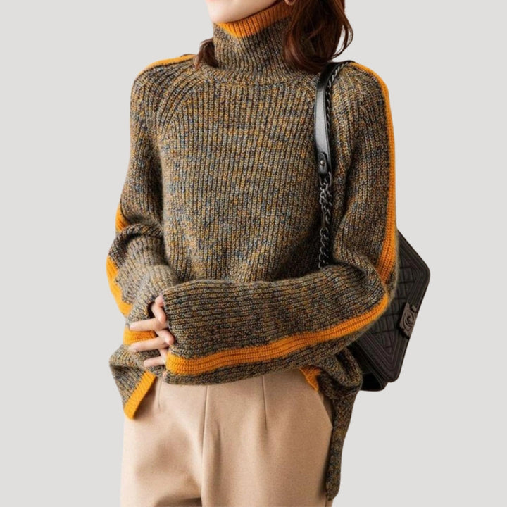 Close-up of a comfortable long-sleeve women's ribbed knit turtleneck sweater in vibrant orange.