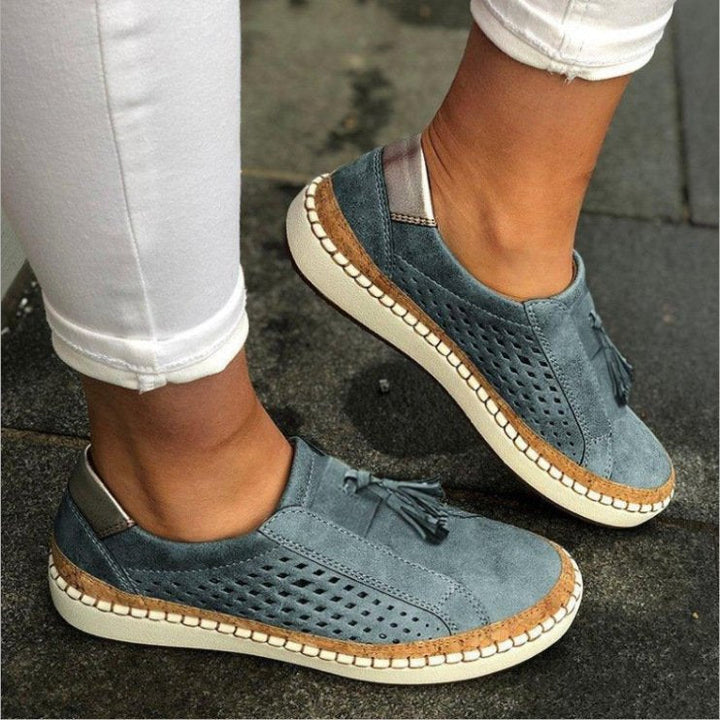 Women's stylish orthopaedic slippers, featuring arch support and slip-on design for all-day comfort & relief.
