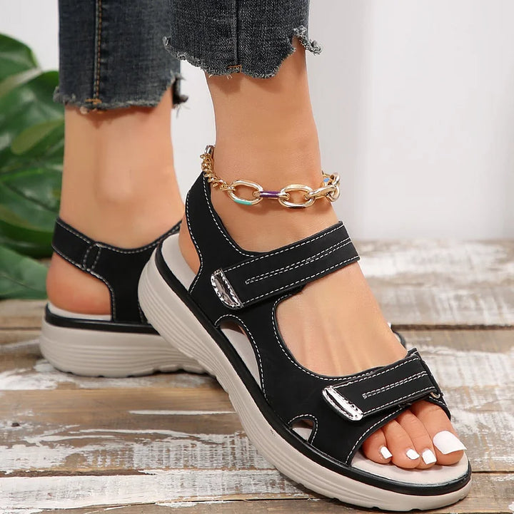 Lightweight women's orthopaedic sandals with soft, adjustable straps for breathable comfort.