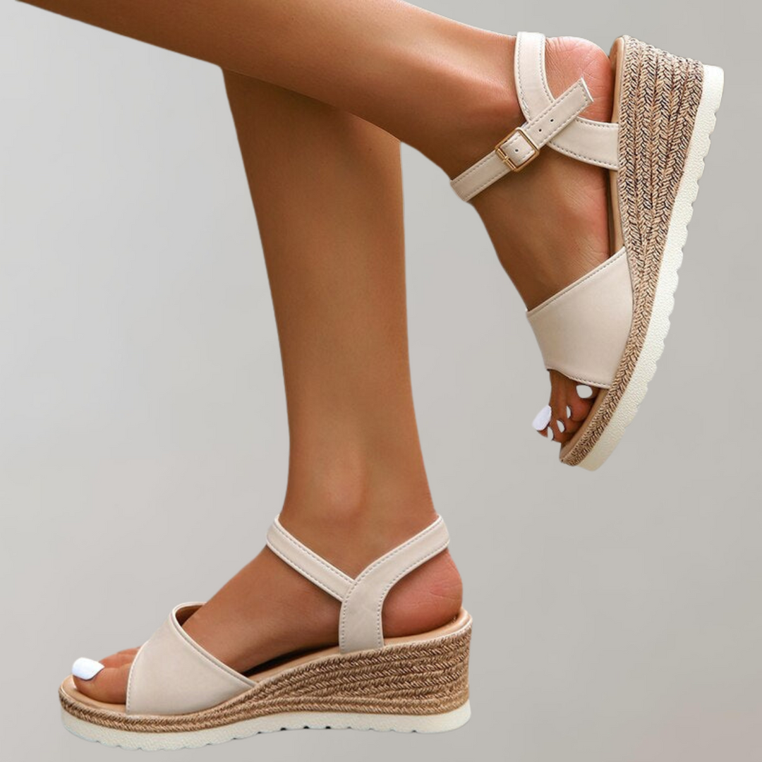 Black orthopaedic wedge sandals for women, offering superior arch support and adjustable comfort straps.