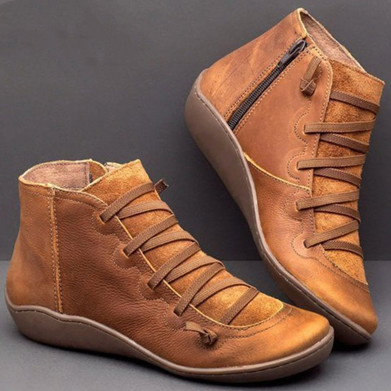 Orthopedic PU leather ankle boots for women. Features arch support, a convenient zip, and superior comfort.