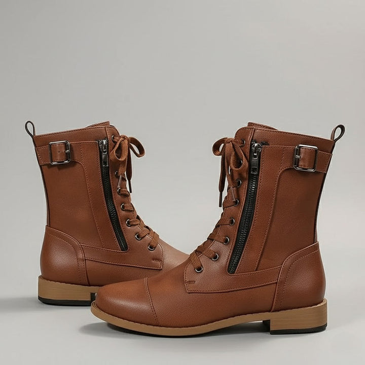 Close-up of women's orthopedic ankle boots featuring side zipper, arch support, and comfortable design.