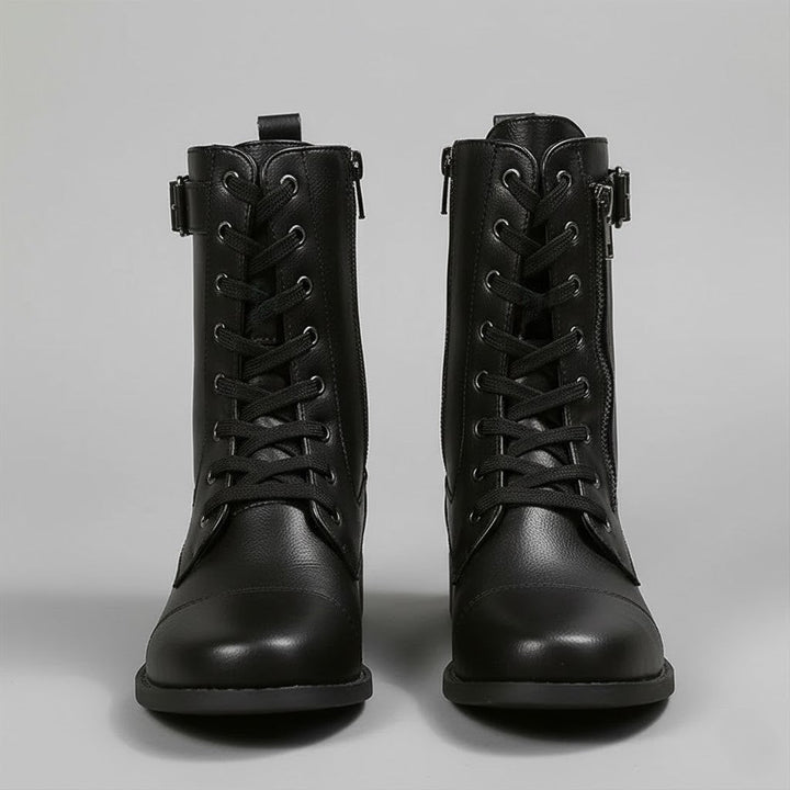Women's black orthopedic ankle boots, side zipper detail, providing arch support and all-day comfort.
