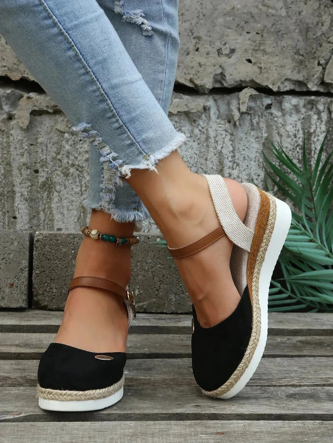 A pair of women's eco-friendly summer sandals with advanced orthopedic arch support.
