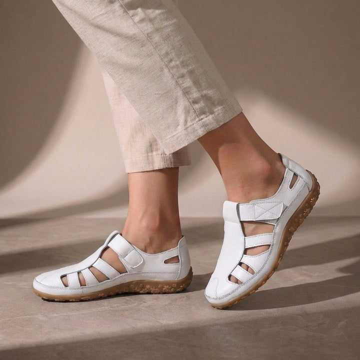 Women's orthopedic closed-toe sandals with adjustable straps, designed for comfort & foot support.