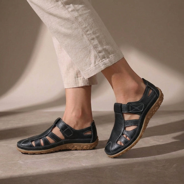 Closed-toe women's walking sandals featuring adjustable hook-and-loop straps for a secure, comfortable fit.