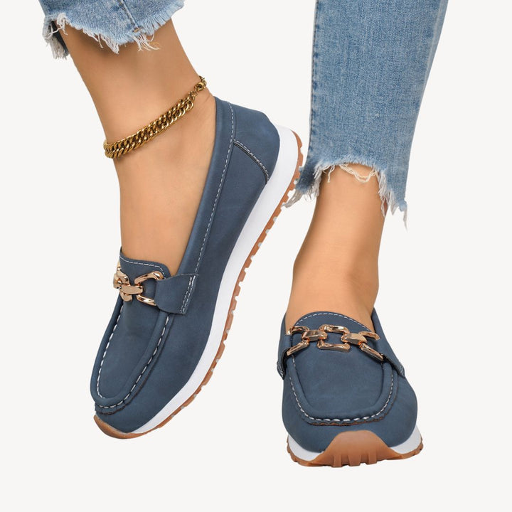 Fashionable women's loafers with a chic chain, combining orthopedic support with modern style.