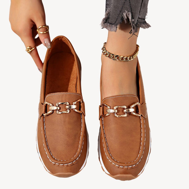 Premium women's orthopedic loafers with a chic chain, offering superior foot support & all-day comfort.
