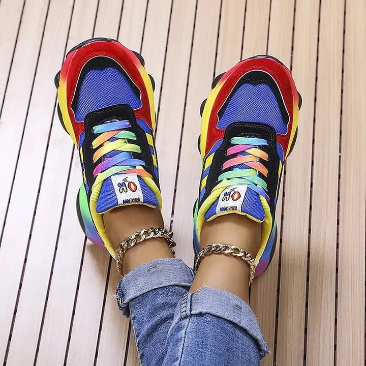 Vibrant women's orthopedic rainbow trainers: lightweight, wide fit, arch support for ultimate walking comfort.