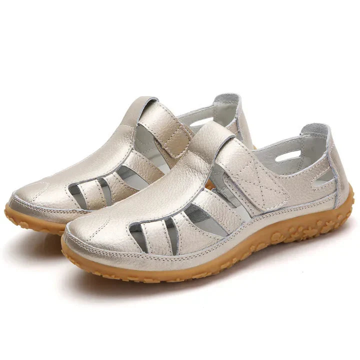 Close-up of women's orthopedic sandals, showing adjustable straps, cushioned footbed, and anti-slip sole.