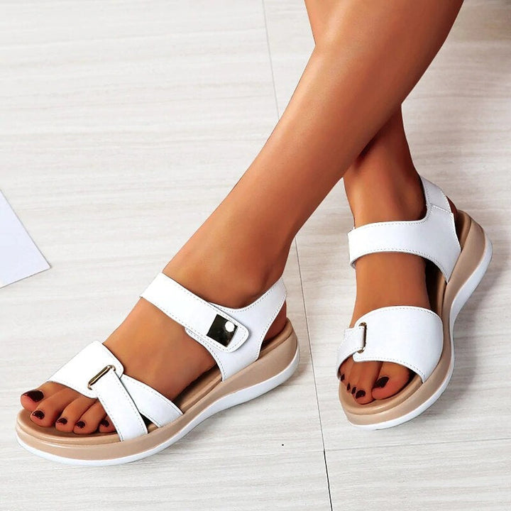 Women's orthopedic sandals with adjustable straps & cushioned footbed for ultimate arch support & walking comfort.