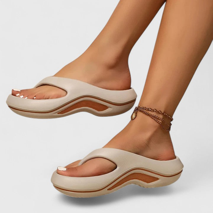 Stylish women's slide sandals with ergonomic design, offering supreme comfort & arch support for everyday wear.