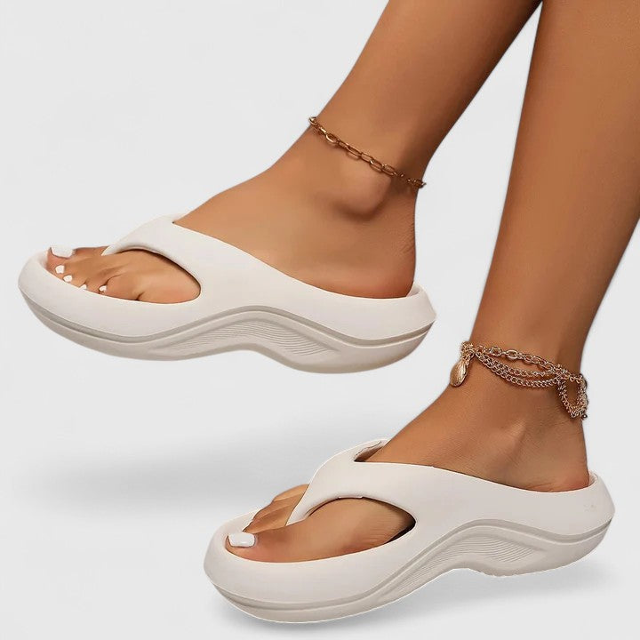 Soft, cloud-like women's orthopedic slides, providing ultimate comfort and arch support for active feet.