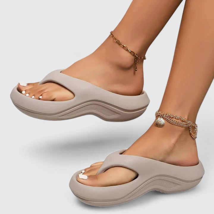 Versatile women's slip-on orthopedic slides for everyday wear, featuring cloud-like comfort & arch support.