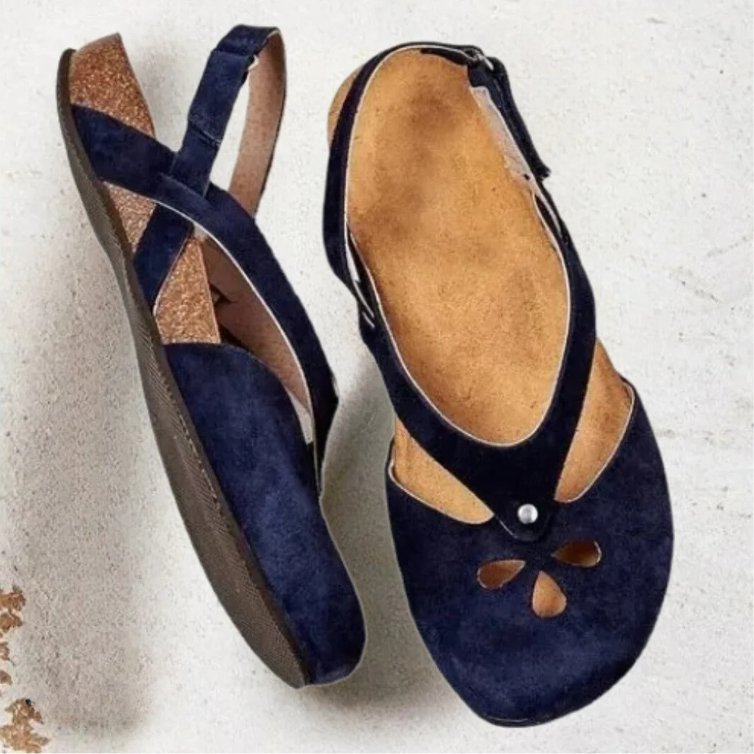 Adjustable women's orthopedic slingback sandals with cross-strap, providing arch support for comfortable walking.
