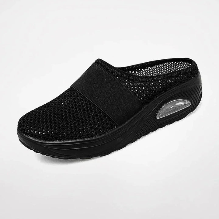 Plush women's orthopedic slippers, offering ergonomic arch support & cozy comfort for casual indoor wear.