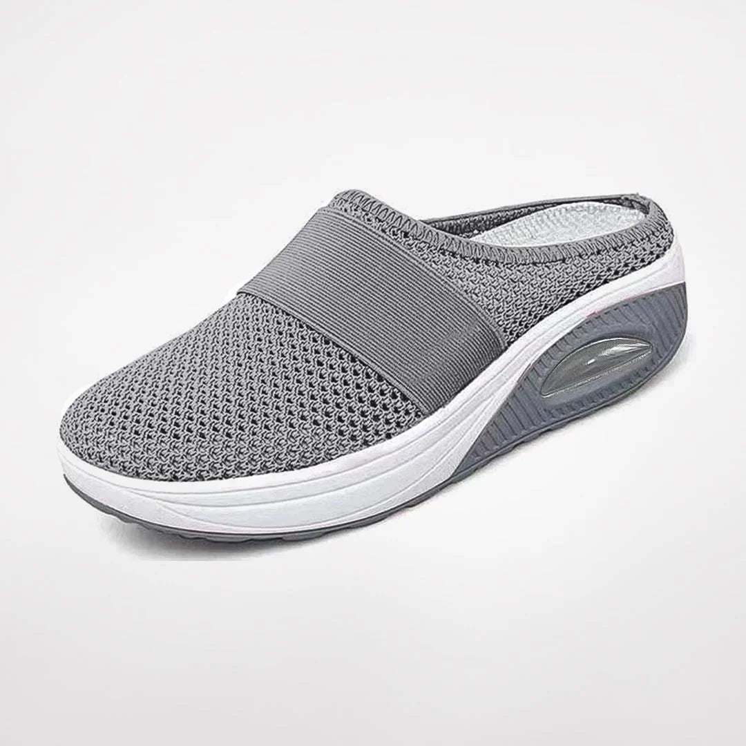 Durable women's orthopedic slippers, designed with deep arch support & a non-slip sole for ultimate foot comfort.