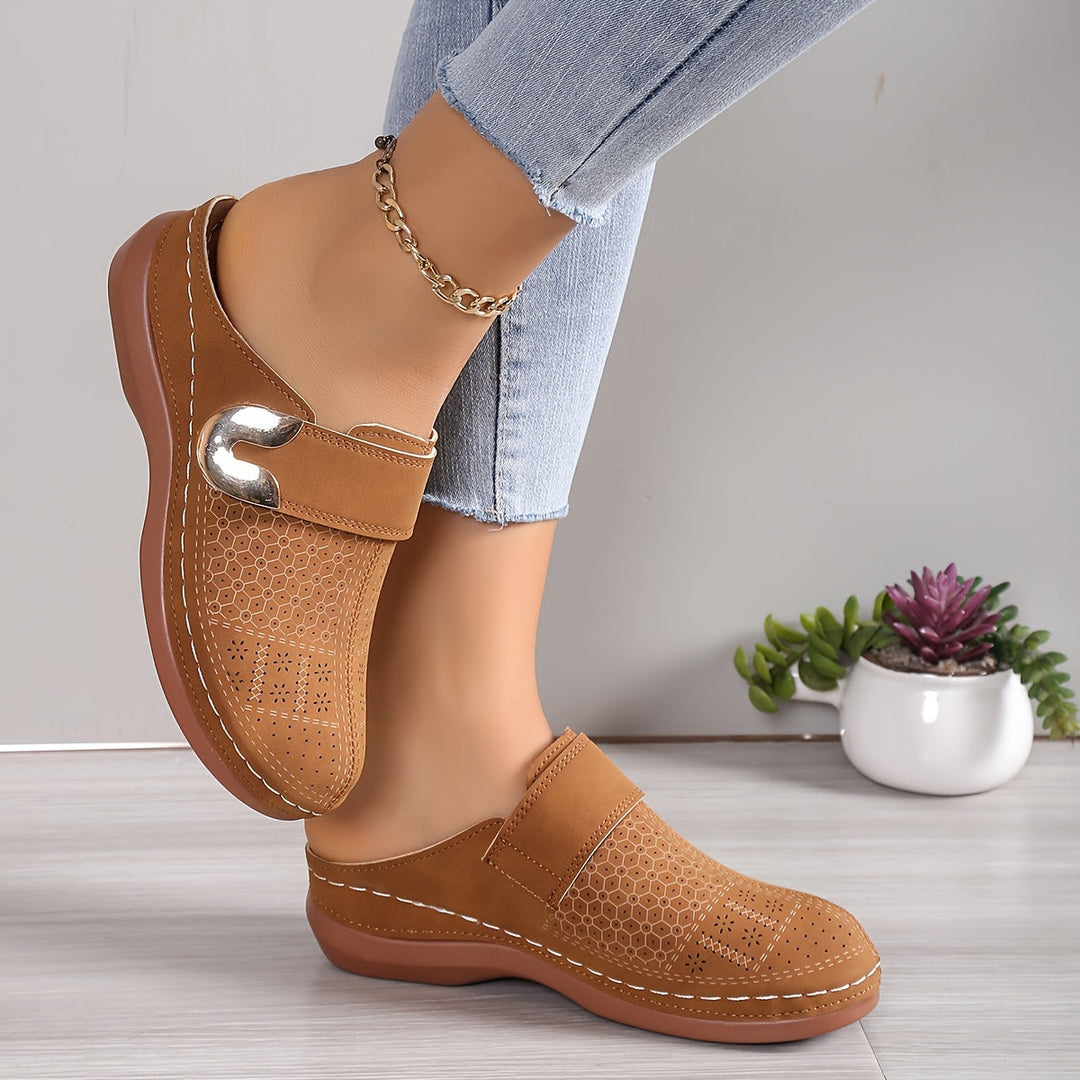Comfortable women's orthopedic arch support slippers with a non-slip sole, perfect for indoor foot relief.