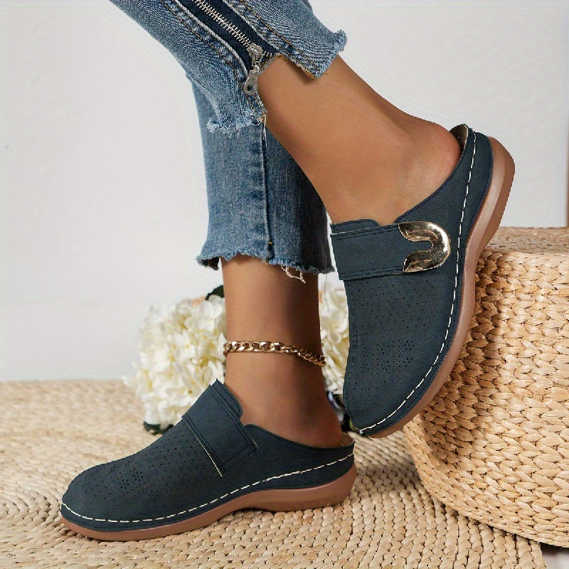 Soft women's orthopedic slippers with arch support & a non-slip sole, ensuring comfortable and secure indoor steps.