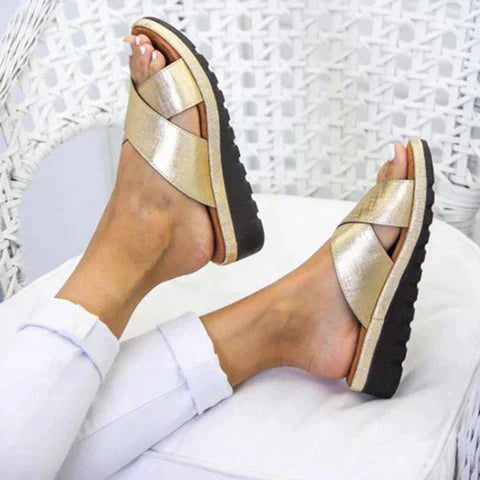 Woman wearing black orthopedic summer sandals, providing arch support and casual comfort