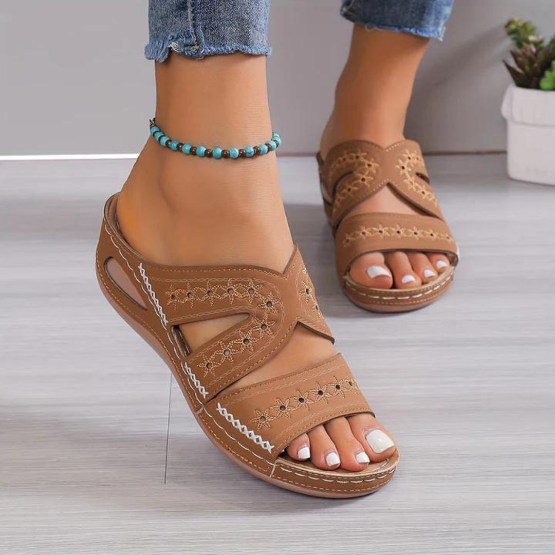 Blue women's orthopedic sandals with wide straps, offering comfort and support for daily wear