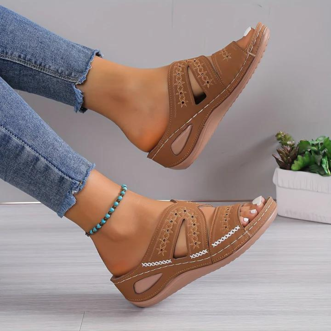 Close-up of women's orthopedic sandal sole detail, showcasing arch support and soft footbed
