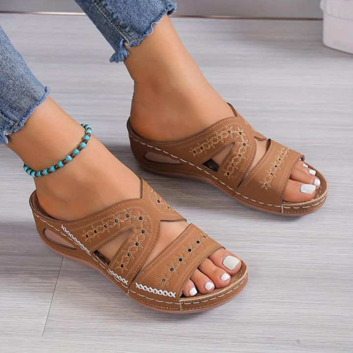 Pair of black women's orthopedic summer sandals, ready for comfortable casual outings