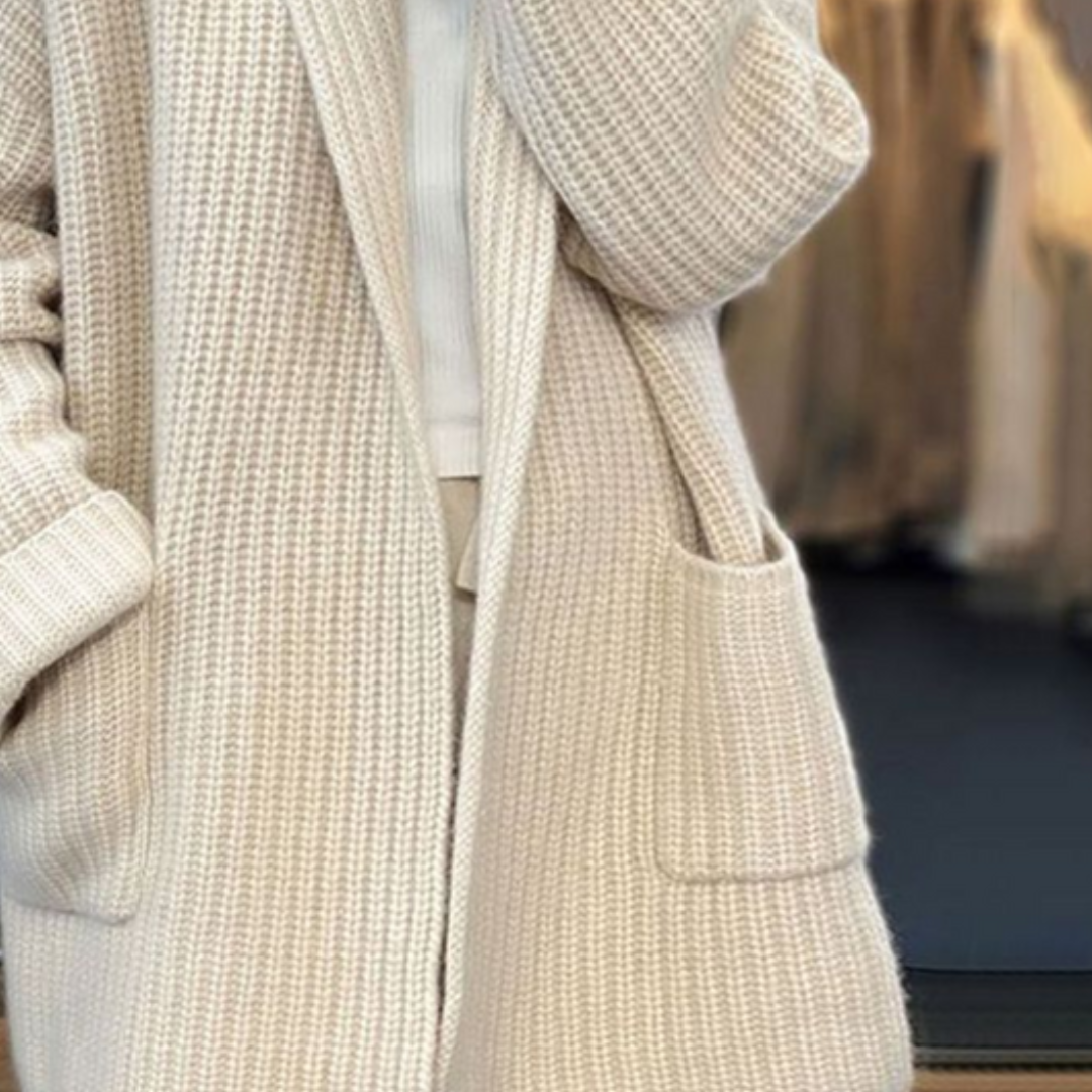 Stylish women's oversized wool cardigan in beige, featuring an open front cut, ideal for winter layering.