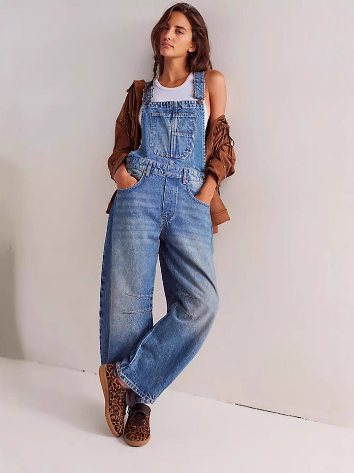 Women's oversized casual beige overalls with practical utility pockets. Comfortable relaxed fit.