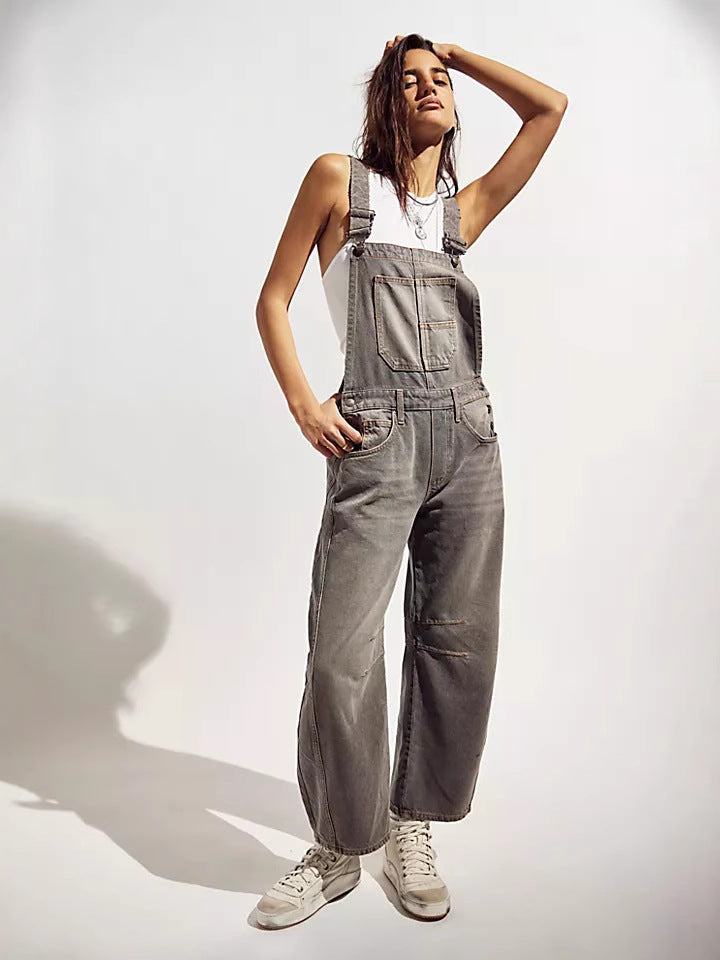 Blue women's oversized overalls, comfortable & versatile. Features adjustable straps and practical pockets.
