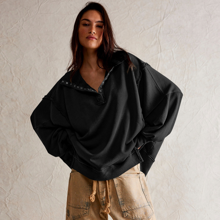 Women's oversized Henley pullover in a relaxed fit, perfect for casual everyday wear. Comfortable long sleeve top.