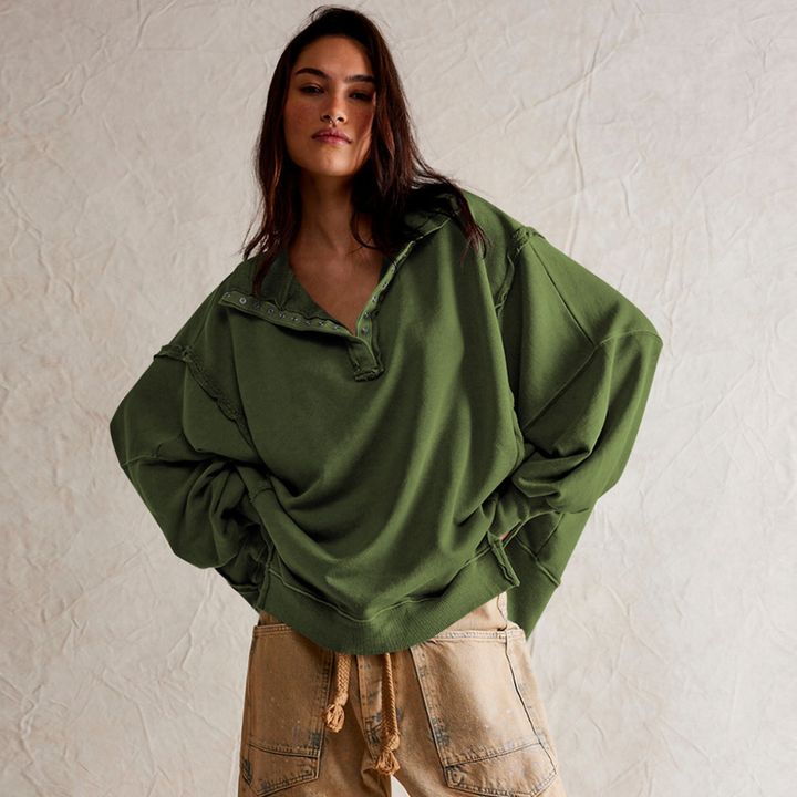 Versatile women's oversized Henley pullover. Relaxed fit long sleeve top for casual spring and fall outfits.