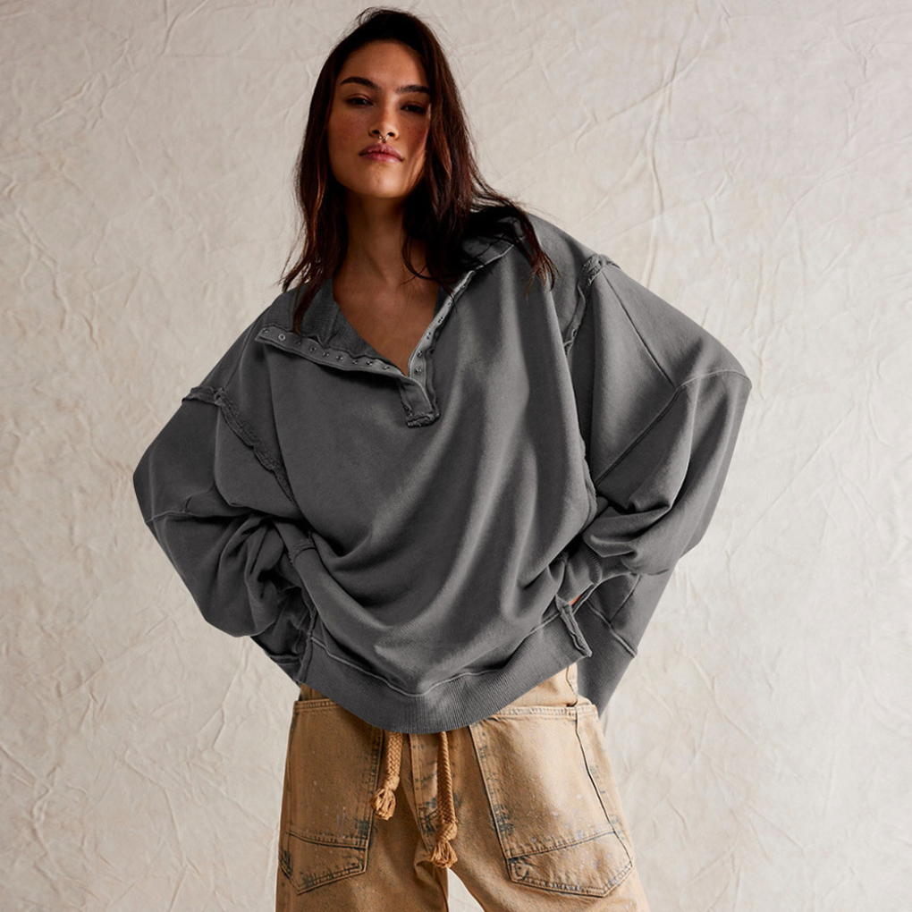 Front view of a women's oversized Henley pullover. Relaxed fit long sleeve casual top for easy everyday style.