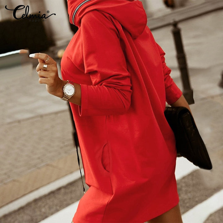 Modern women's oversized hoodie dress featuring a stylish zip detail. Perfect for streetwear fashion.