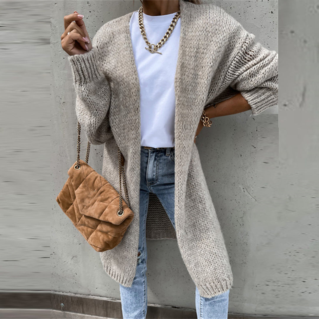 Chic women's oversized knit duster cardigan, a must-have long layering top for modern fashion.