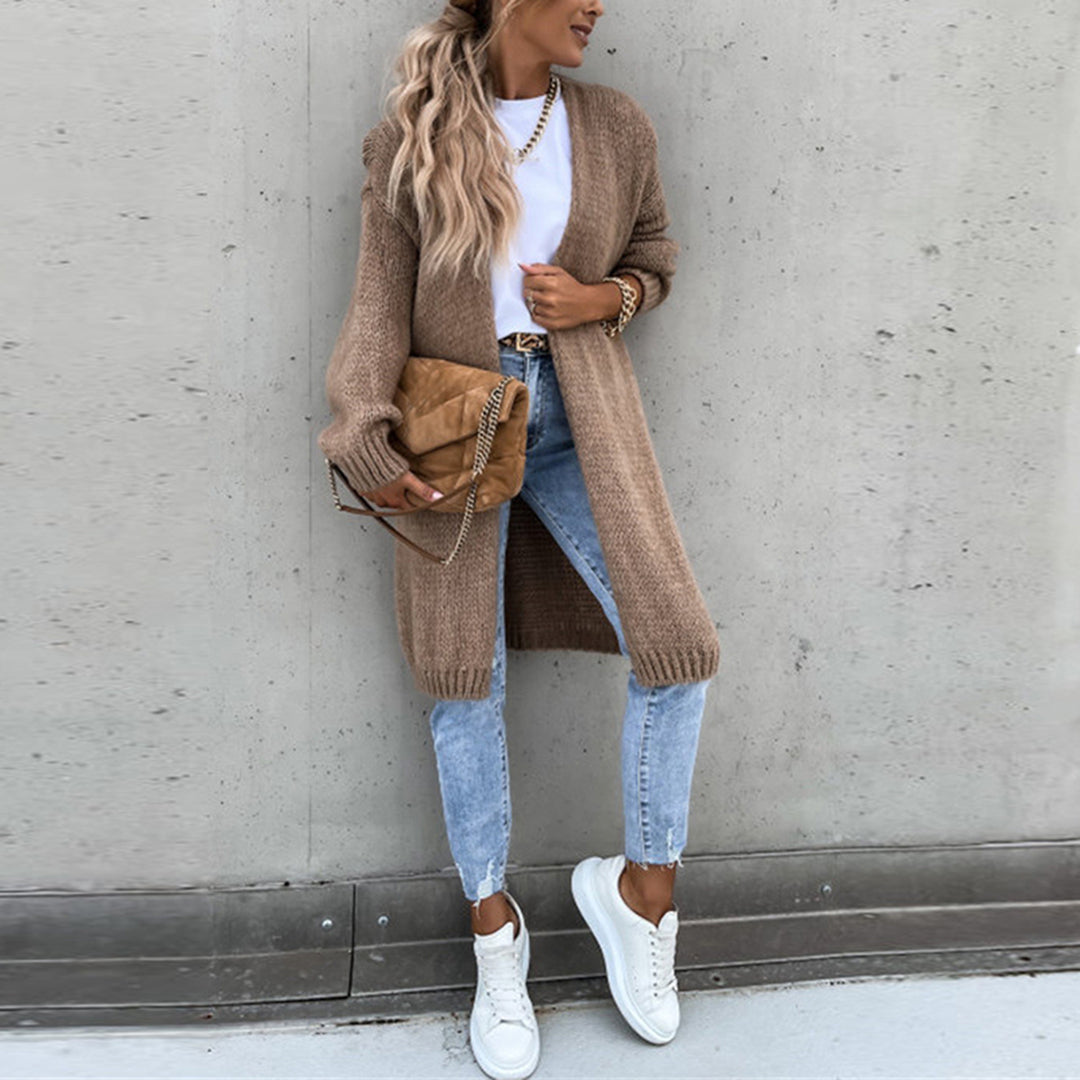 Stylish women's long knit duster cardigan, oversized and breathable, an essential layering piece.