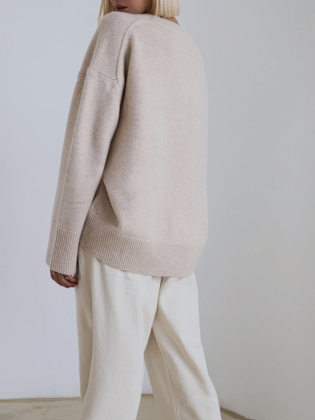 Detail of women's oversized knit sweater hem, comfortable casual wear