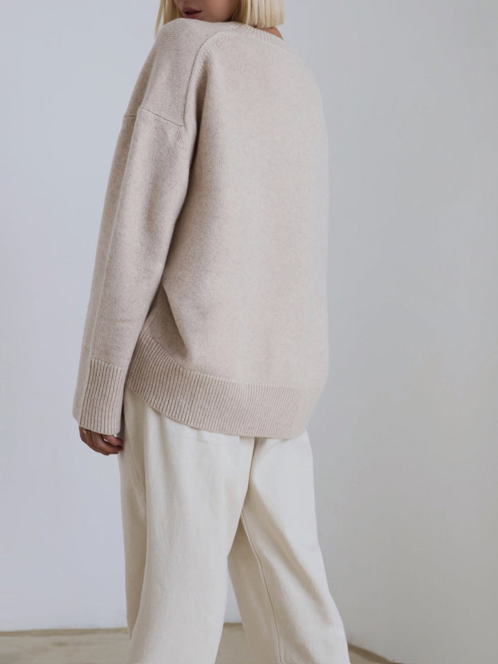 Detail of women's oversized knit sweater hem, comfortable casual wear
