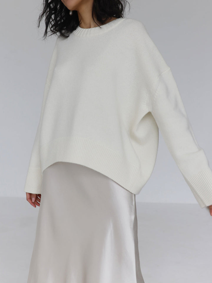 Women's cozy knit pullover sweater in a neutral color, versatile oversized top