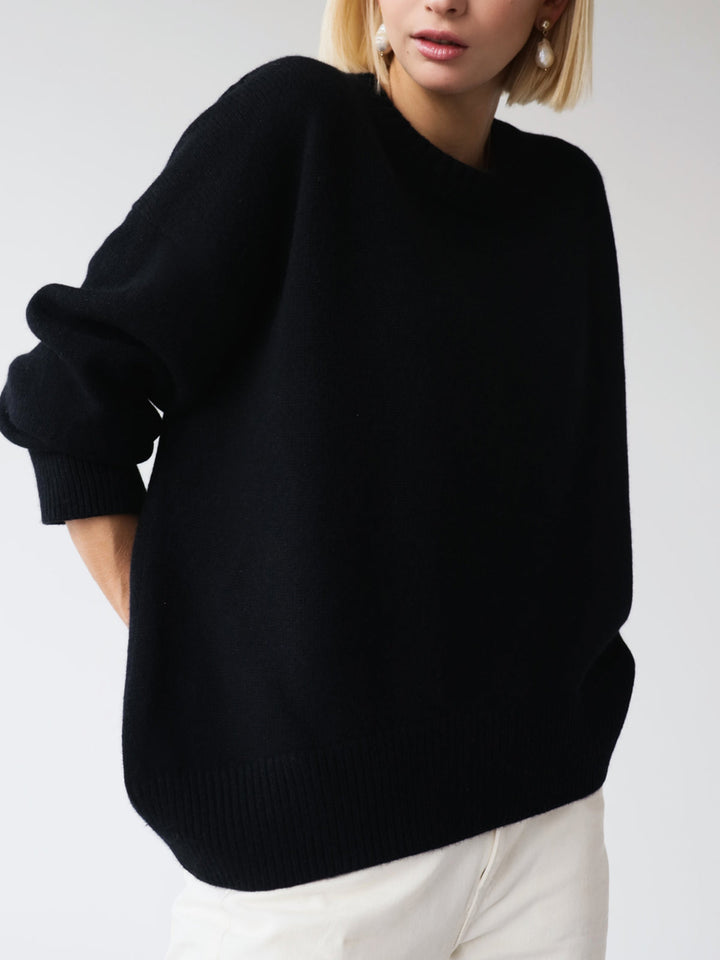 Vertical shot of women's oversized knit pullover sweater, stylish and warm