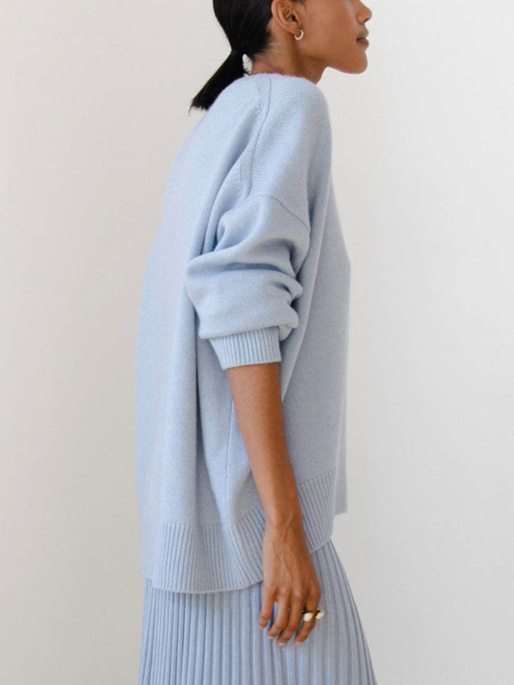 Close-up of women's knit pullover sweater texture, cozy oversized design