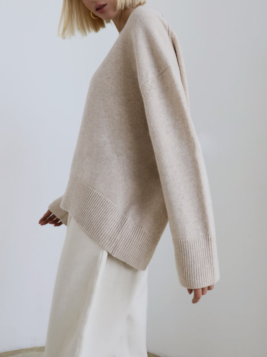 Front view of a women's oversized knit pullover sweater, loose and warm