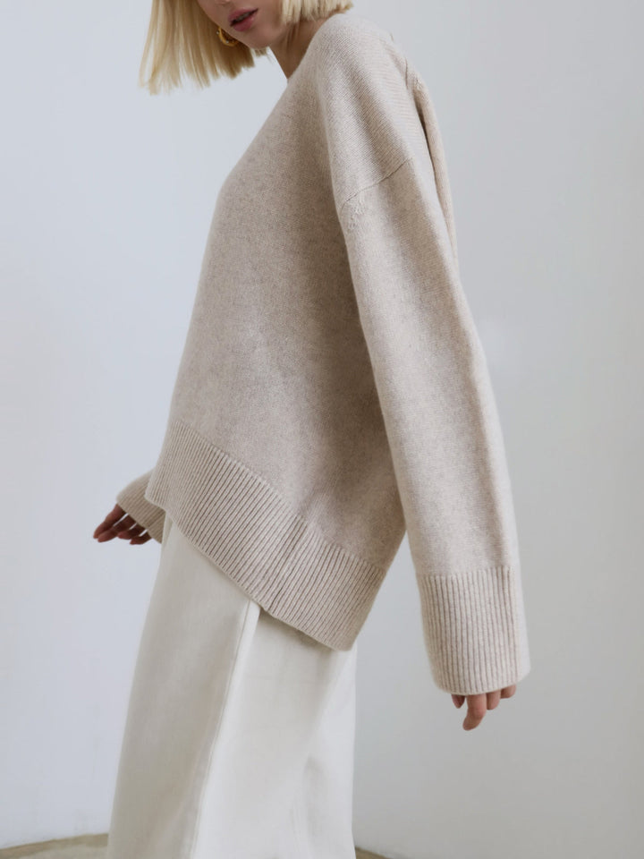 Front view of a women's oversized knit pullover sweater, loose and warm