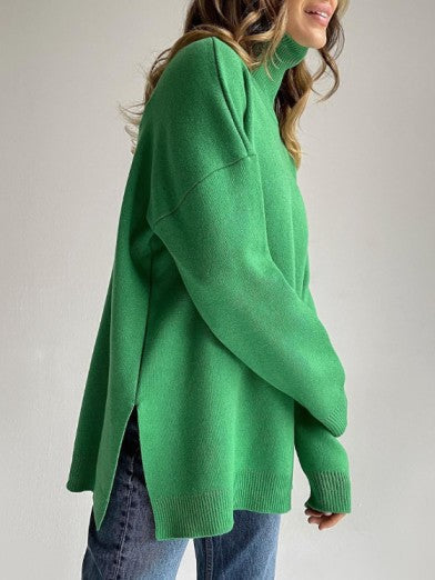 Women's oversized long turtleneck sweater with stylish side slit. Perfect comfortable knitwear for fall and winter.