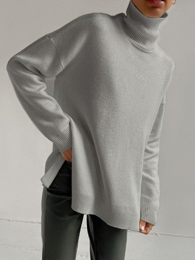 Cozy women's oversized long turtleneck sweater with a fashionable side slit. Essential comfortable fall & winter knitwear.