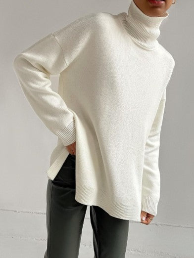 Soft knit women's oversized long turtleneck sweater. Elegant side slit, perfect fall and winter comfort & style.