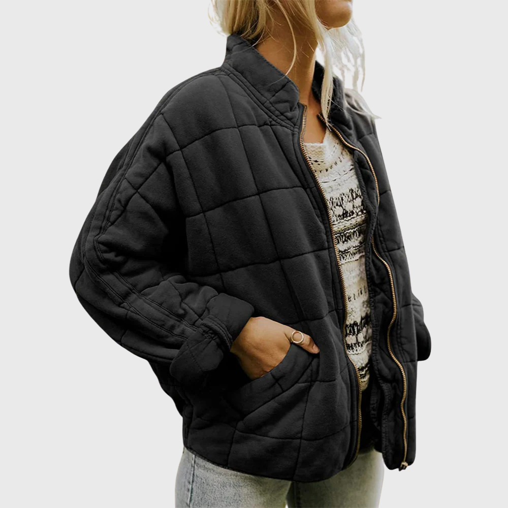 Full length view of a women's oversized mid-season coat, padded, ideal for outerwear