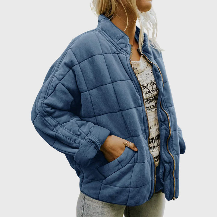 Close up of the fabric texture of a women's oversized coat, mid-season casual jacket